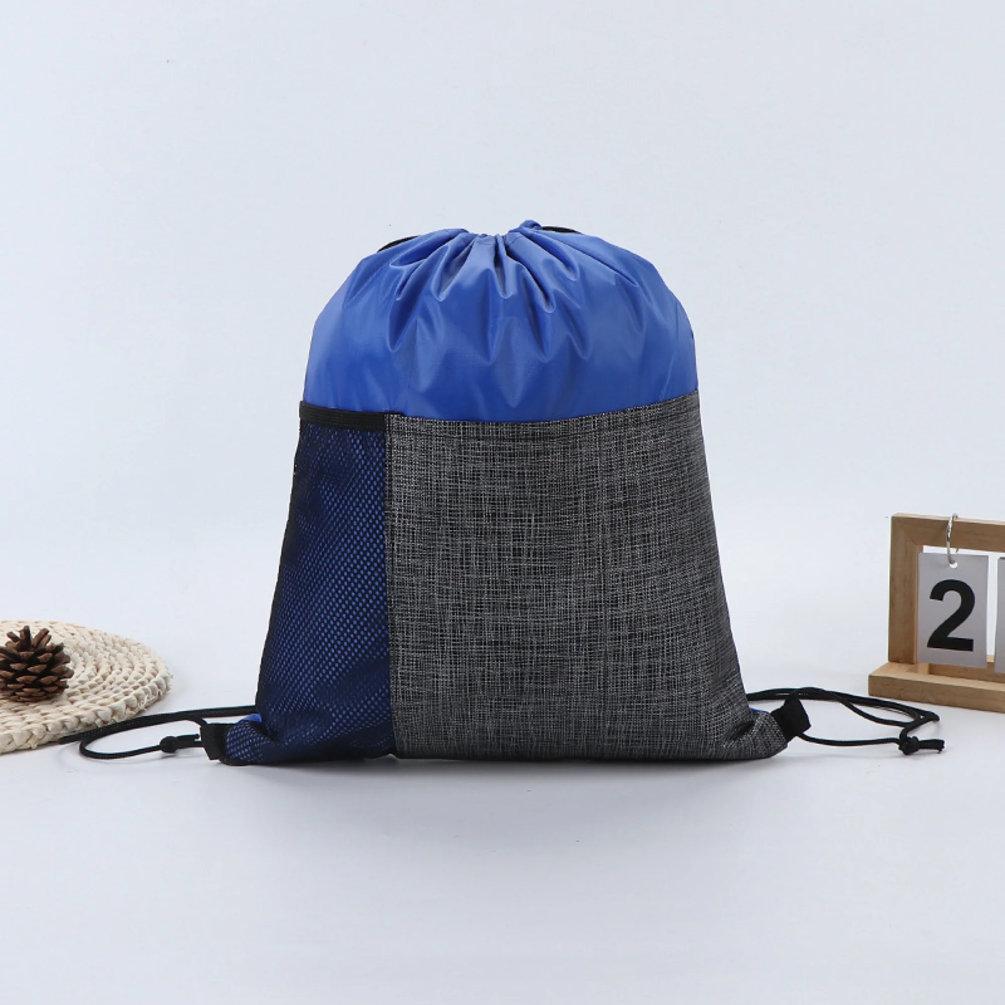 Drawstring Backpack With Front Pocket And Mesh Side Storage