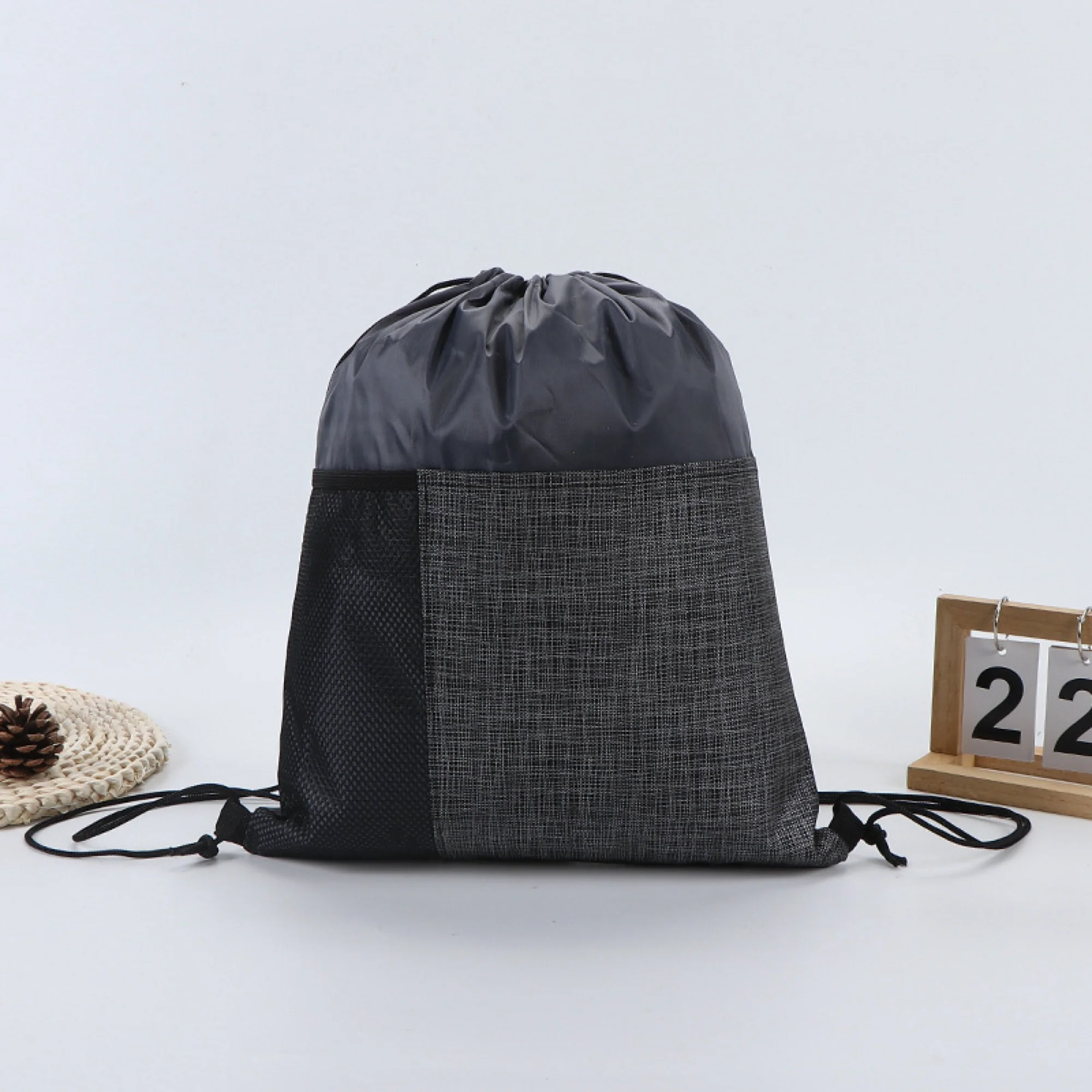 Drawstring Backpack With Front Pocket And Mesh Side Storage