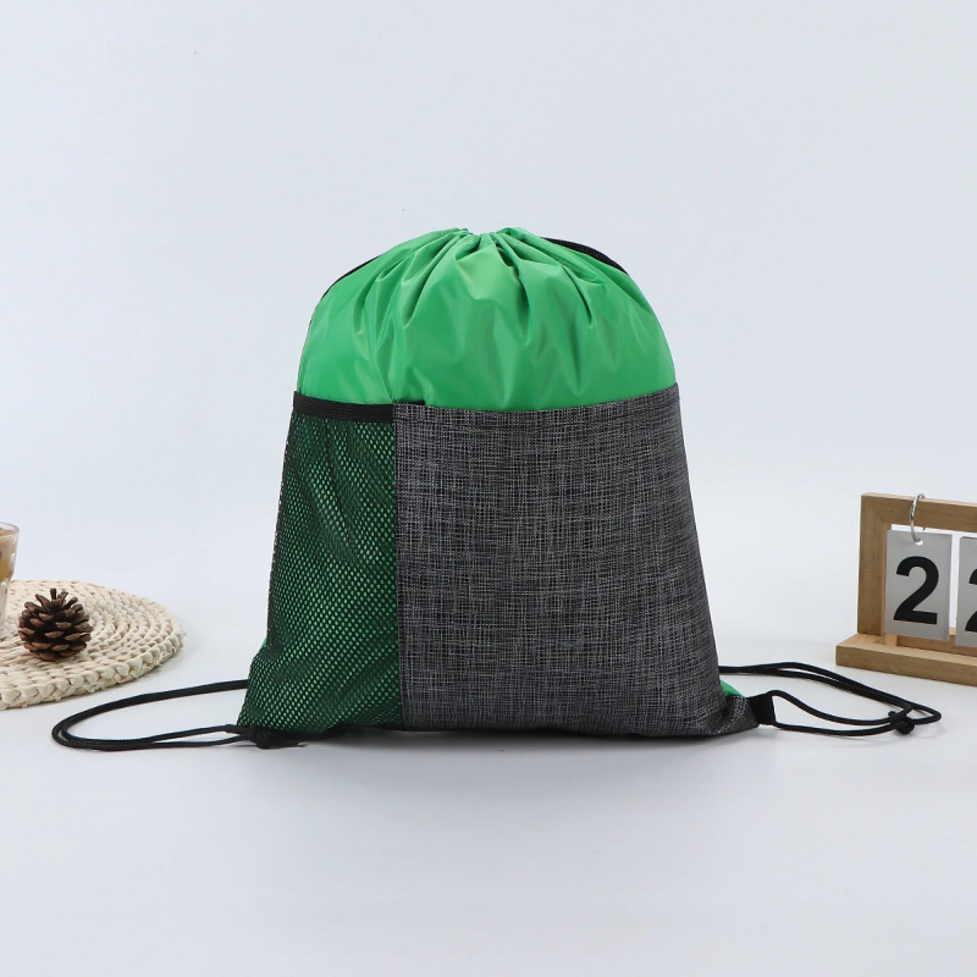 Drawstring Backpack With Front Pocket And Mesh Side Storage